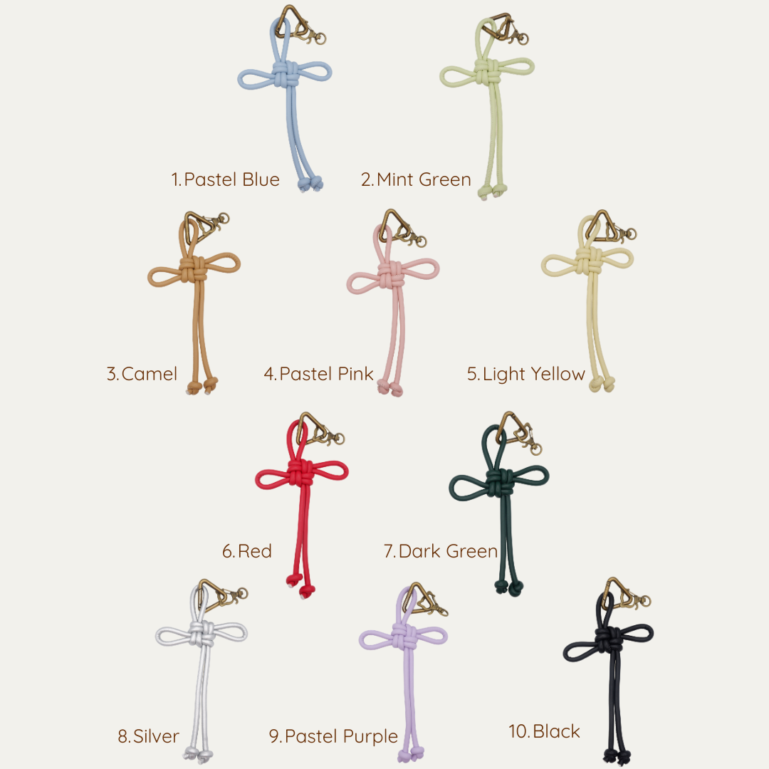 Ten leather cord colour options for anornament's customised cat bag charm — pastel blue to black