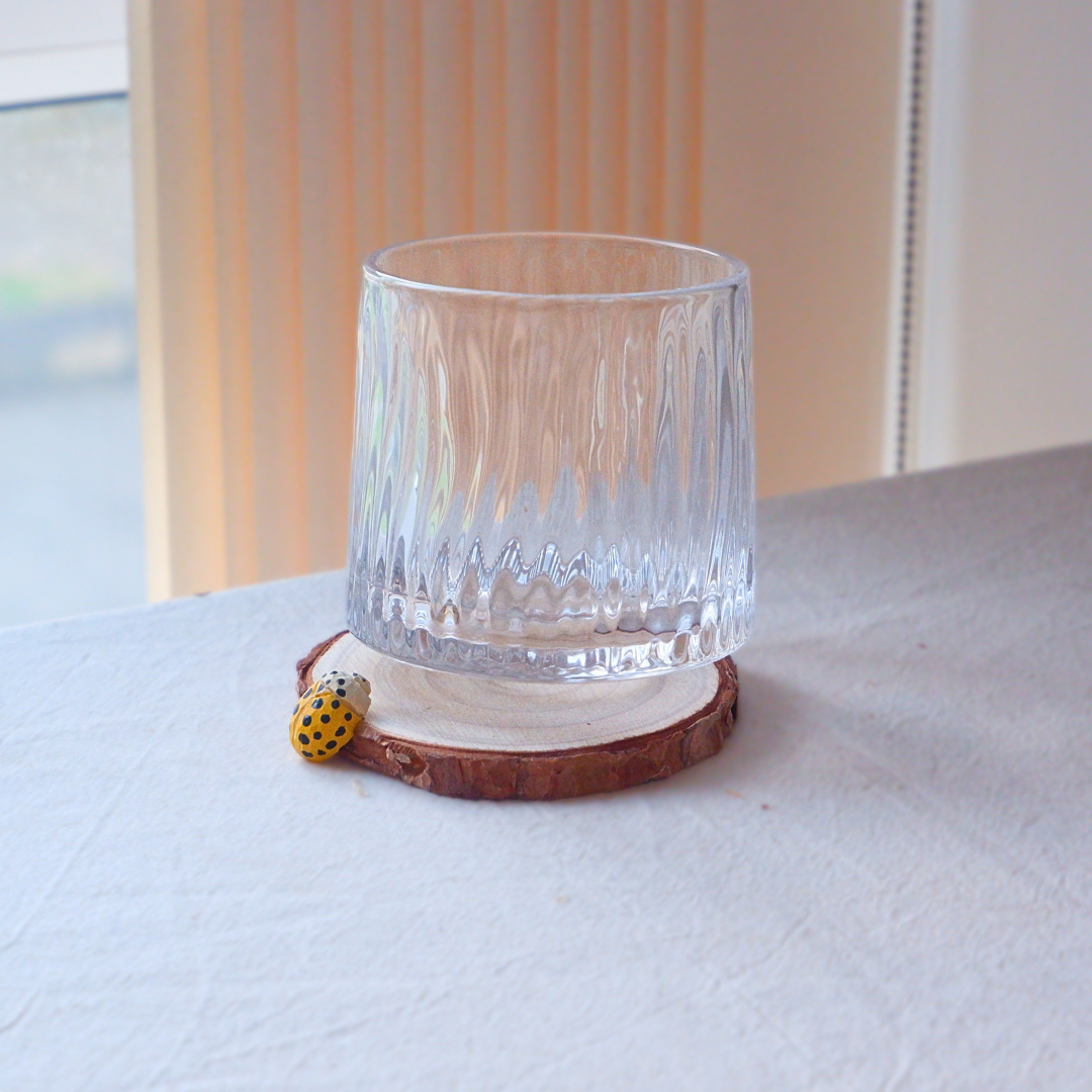 Yellow ladybug coaster hand-carved from linden wood, nature-inspired home decor