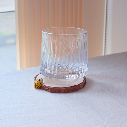 Yellow ladybug coaster hand-carved from linden wood, nature-inspired home decor