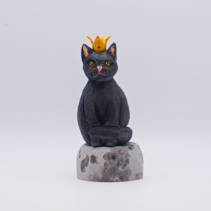 Hand-carved wooden black cat figurine with gold crown seated on painted Moon base by anornament