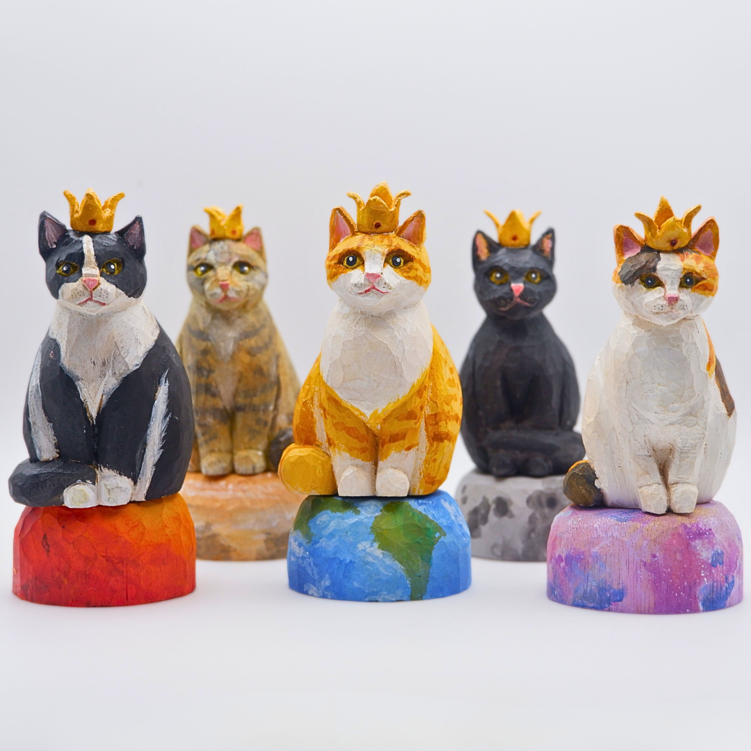 Hand-carved wooden crowned cat figurines on painted planets — The Universe According to Them by anornament