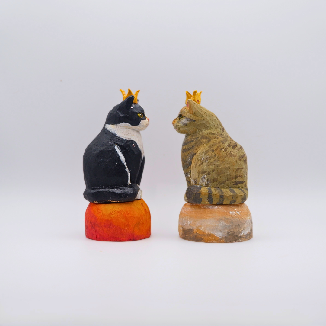 Back detail of wooden Tuxedo and Tabby cat figurines with gold crowns on painted planet bases by anornament