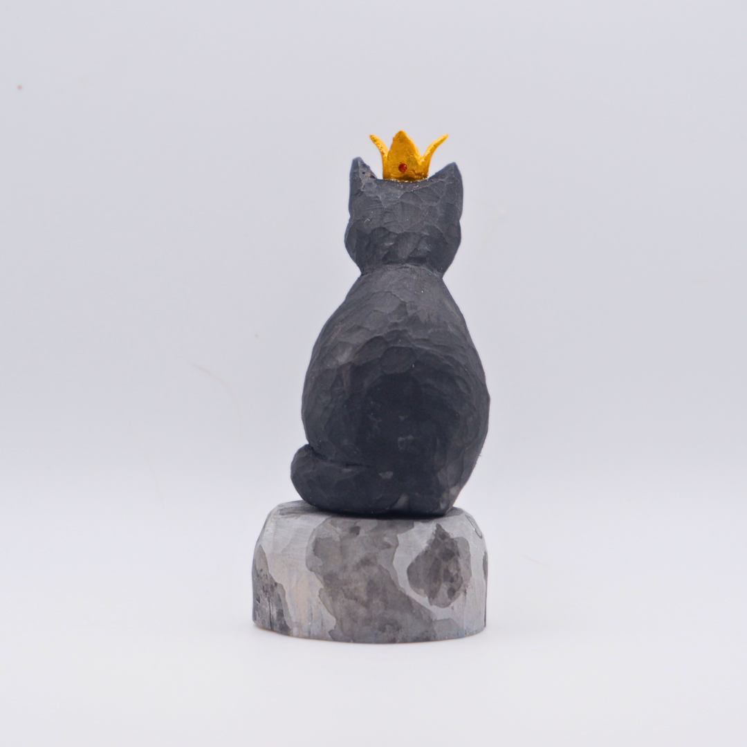 Hand-carved wooden black cat figurine with gold crown seated on painted Moon base by anornament