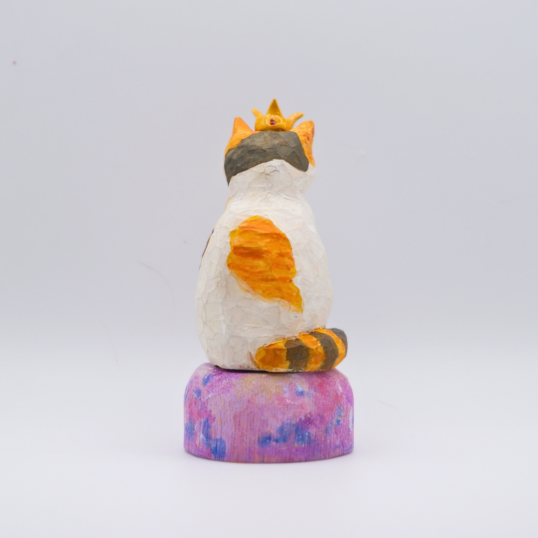Hand-carved wooden Calico cat figurine with gold crown on painted mercury planet base by anornament